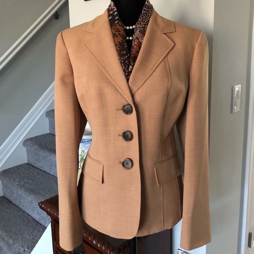 Two piece pants suit with scarf.